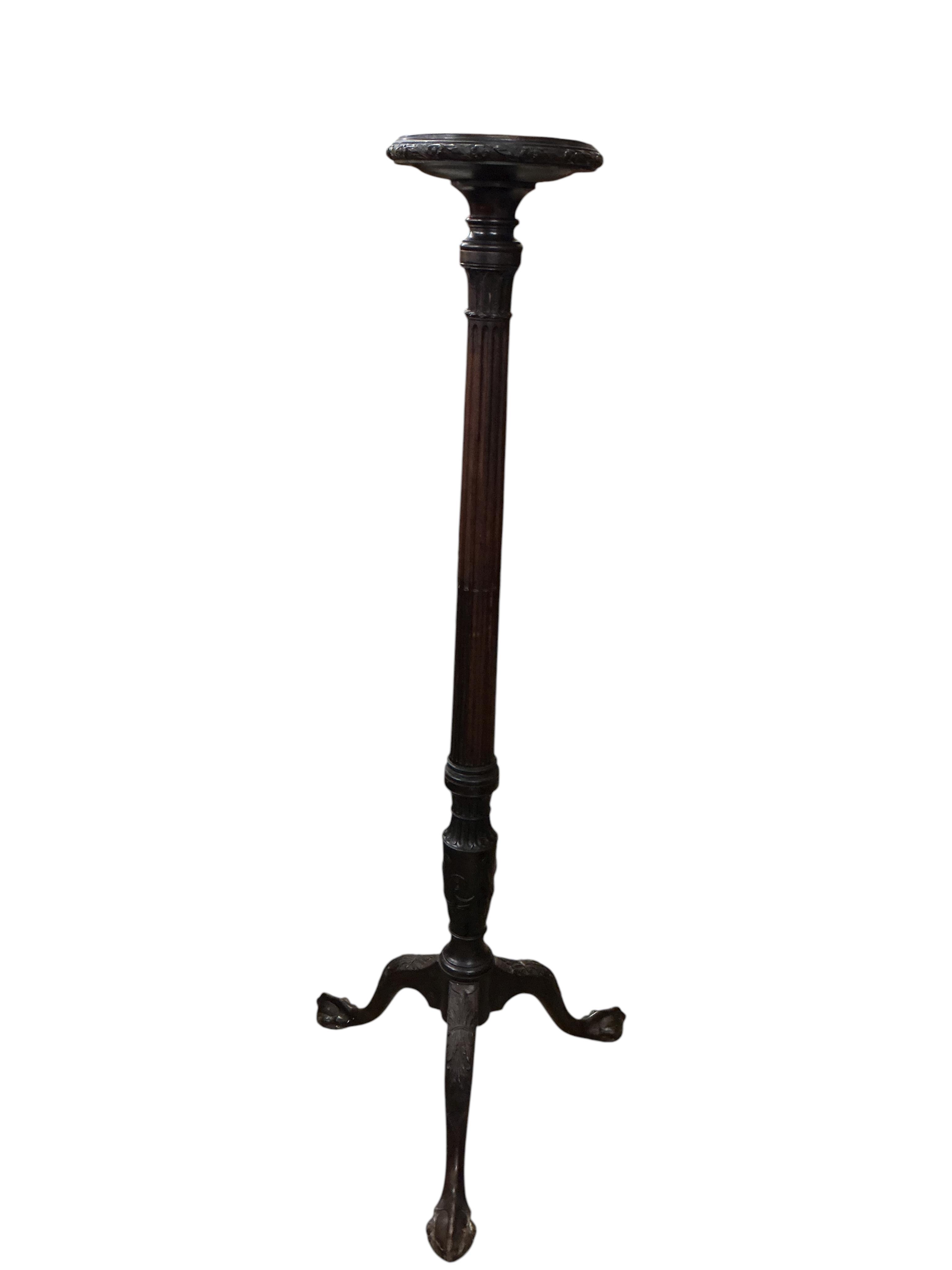 An early 20th century Chippendale Revival mahogany torchere, height 146cm